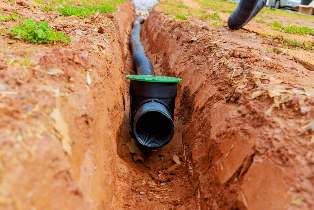 laying underground drainage pipes for outflow in NJ